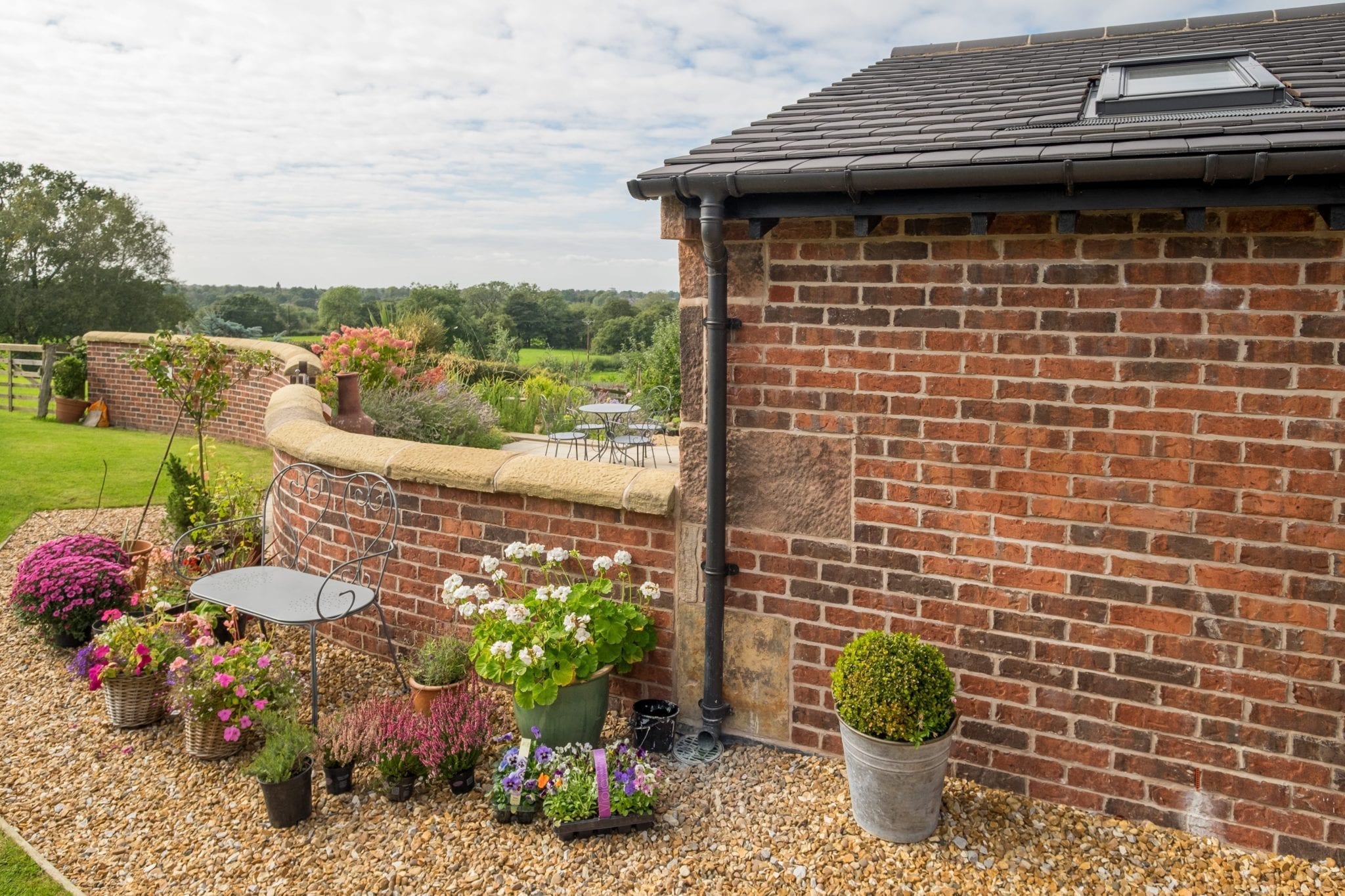 garden seating area with planted pots